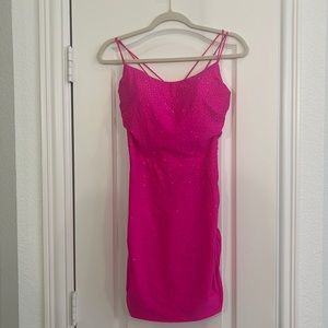 Pink homecoming dress with gems. It has a lace up back, and built in bra pads.
